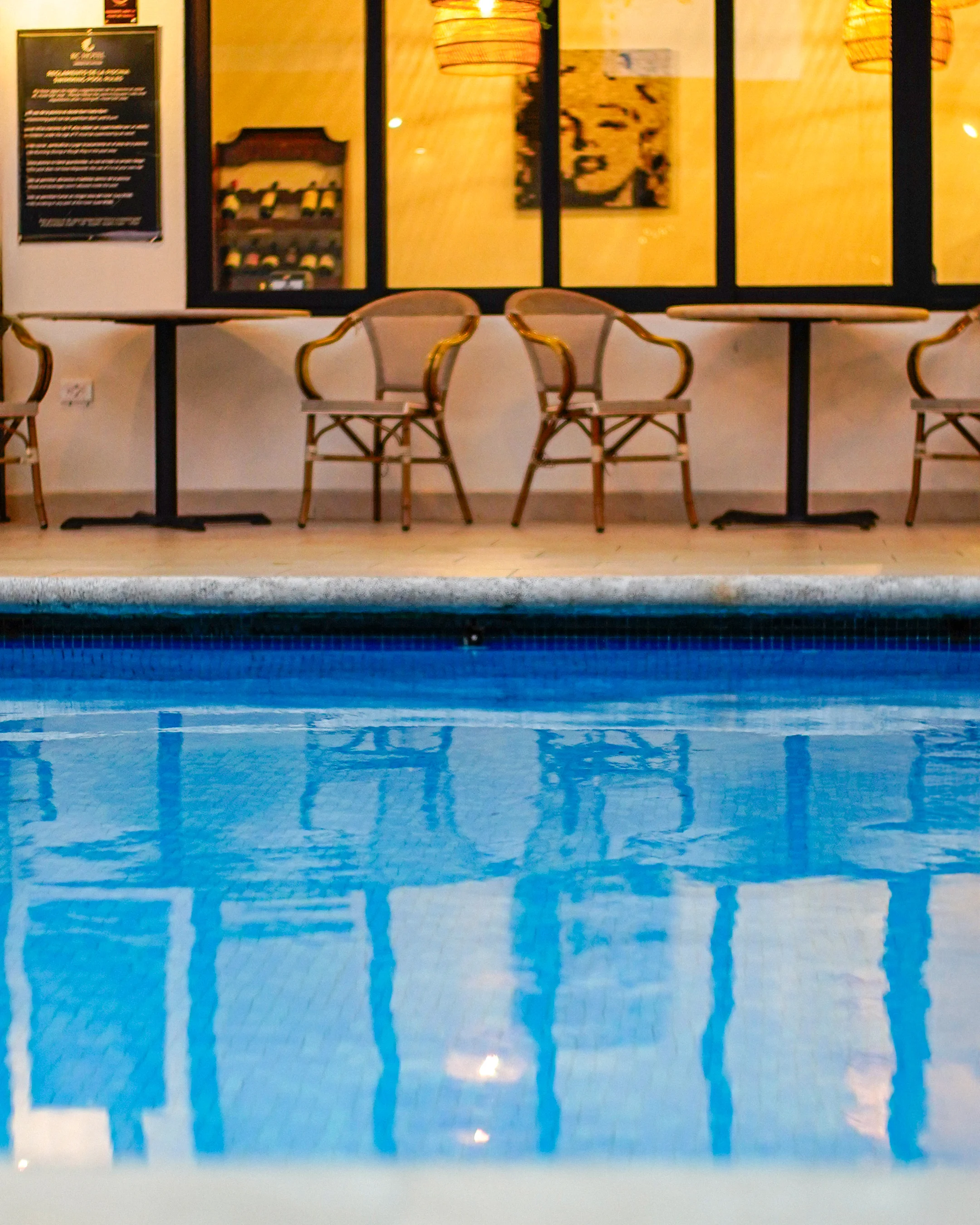 Heated swimming pool at KC Hotel San Jose surrounded by tropical gardens